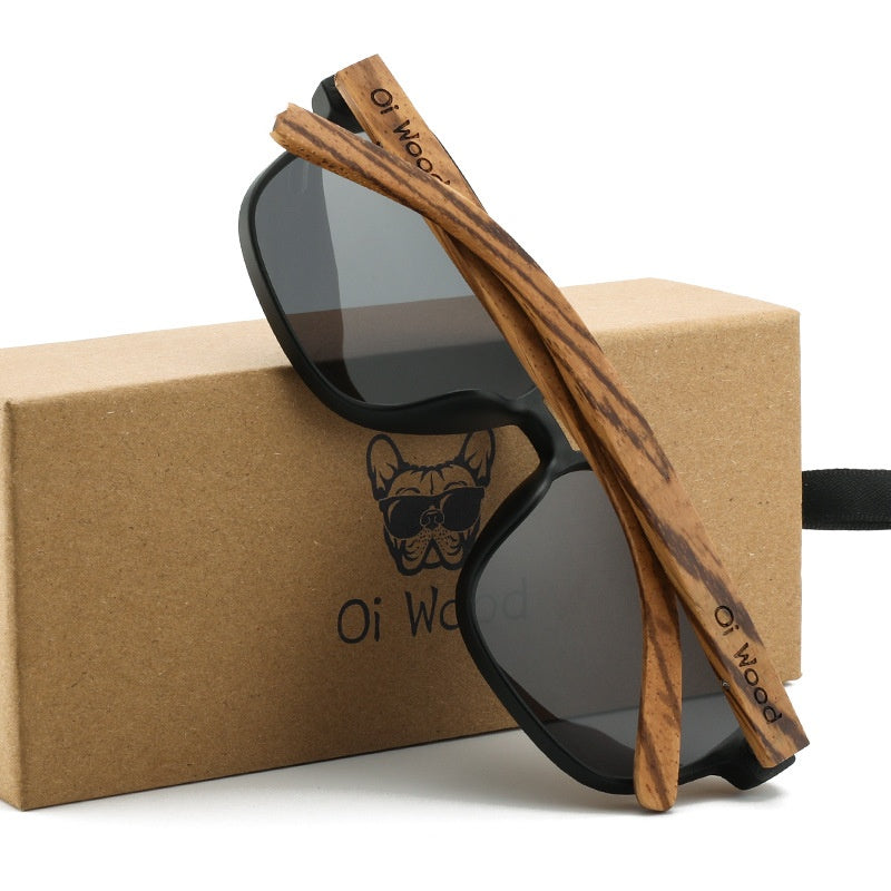 Polarized sunglasses with black frame, dark lenses, and wood temple detailing
