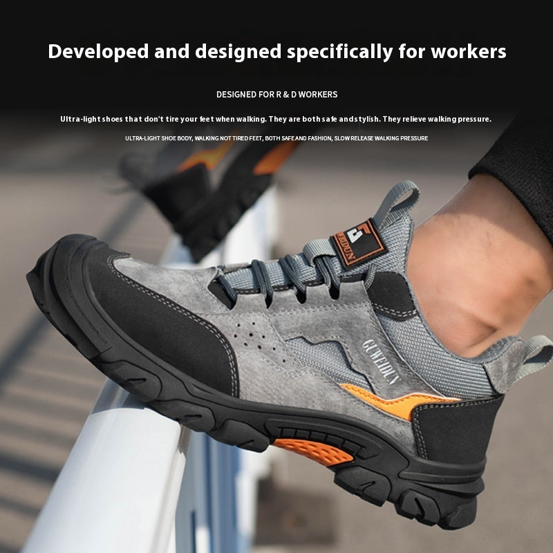 Men's grey and black lace-up work shoe on foot, orange outsole insert