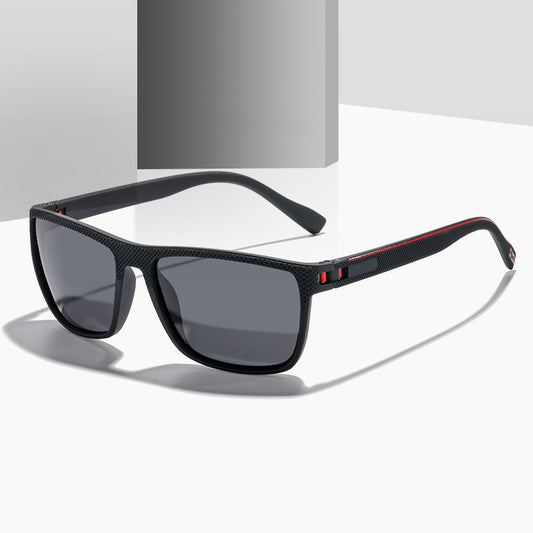 Black sunglasses with red accents on a white background