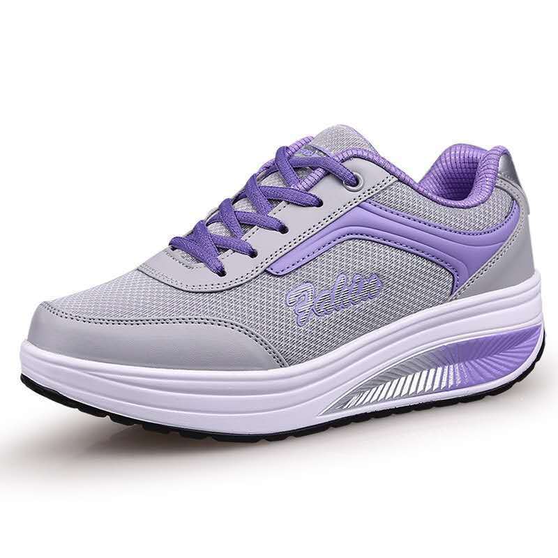 Women’s athletic travel sneaker in lavender and light gray, lace-up with padded collar