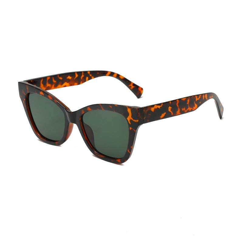 Tortoise-pattern sunglasses with dark green lenses and square cat-eye frames
