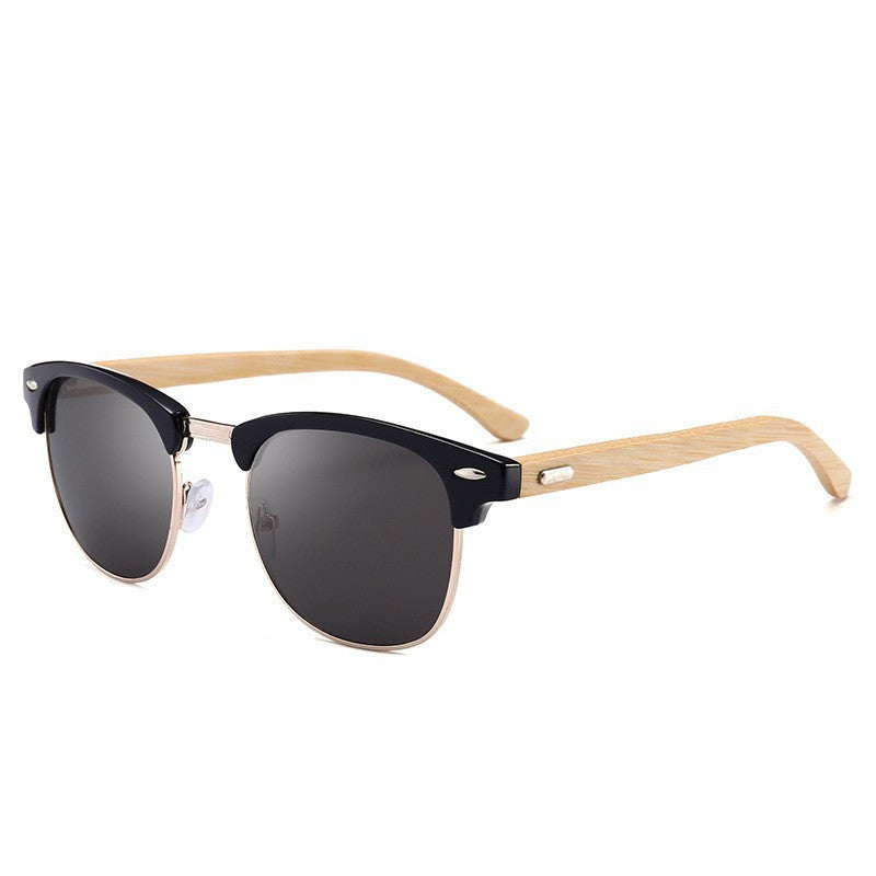 Sunglasses with black lenses and wooden arms on a white background