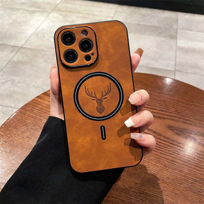 Person holding a phone with a brown leather case featuring a deer emblem.