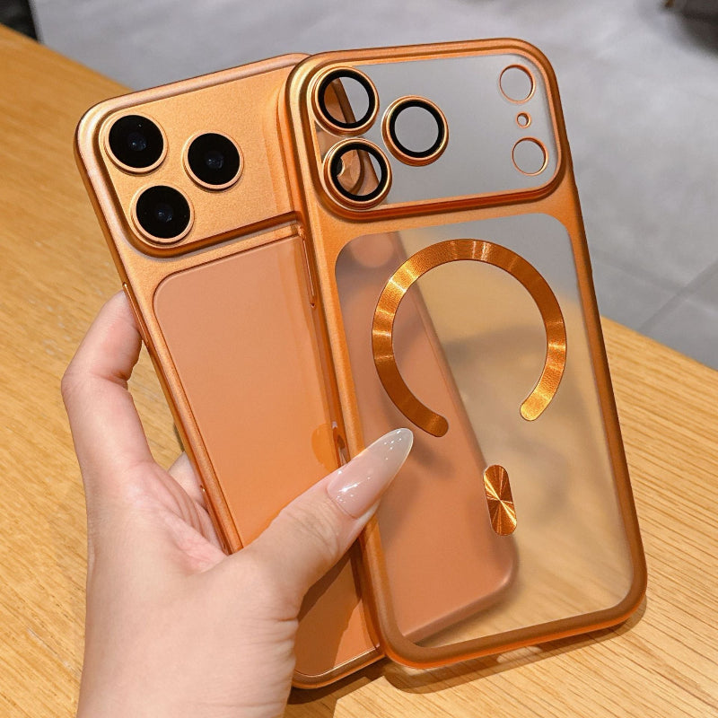 Hand holding a reflective orange phone case on a wooden surface