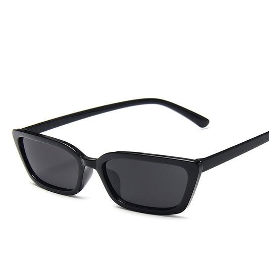 Black sunglasses with dark lenses on a white background
