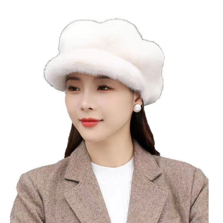 Woman wearing a white fur hat on a white background