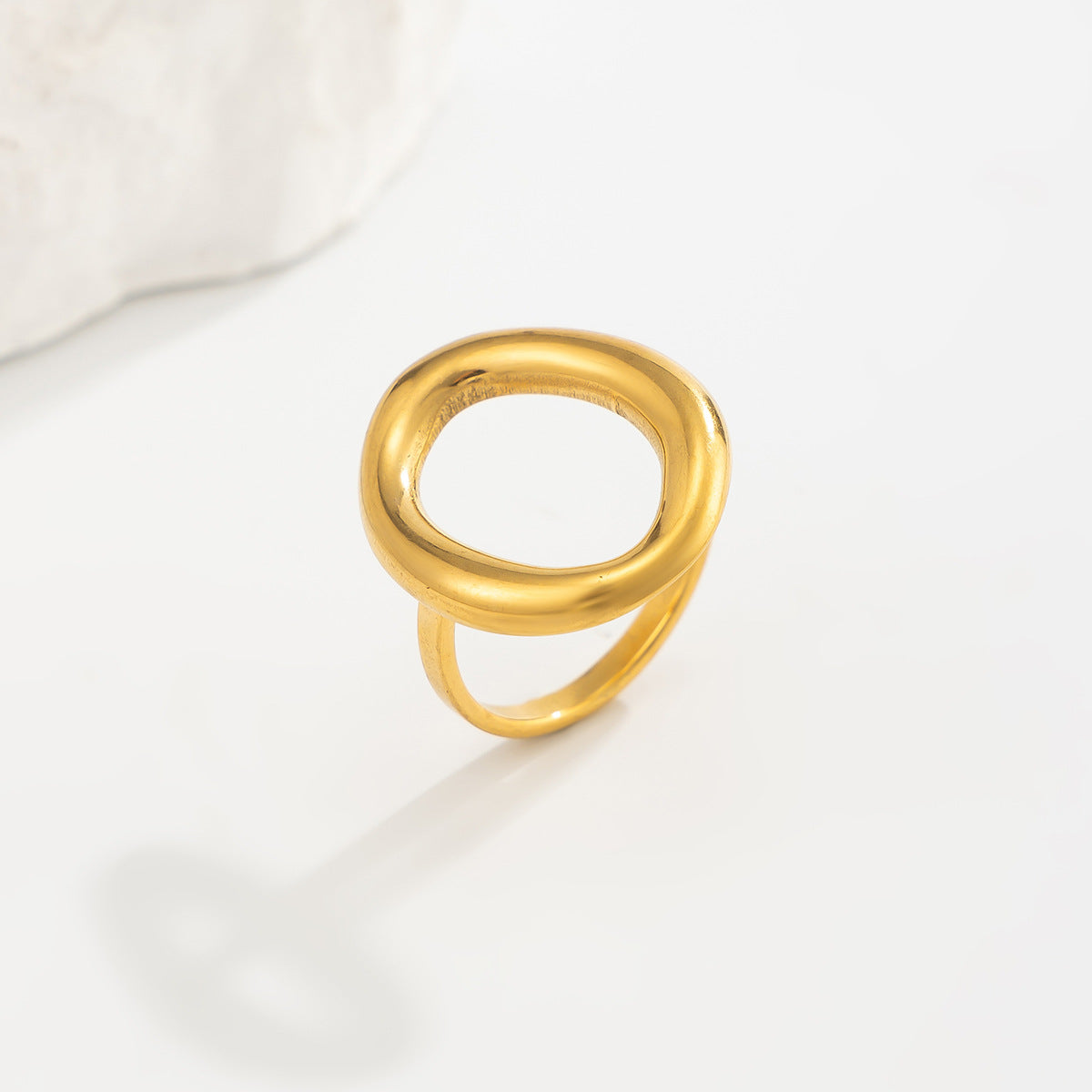 Gold 18K vacuum-plated oval hoop ring with a smooth open center