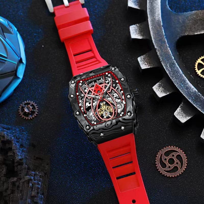 Automatic mechanical watch on red silicone strap with skeleton dial, angled view