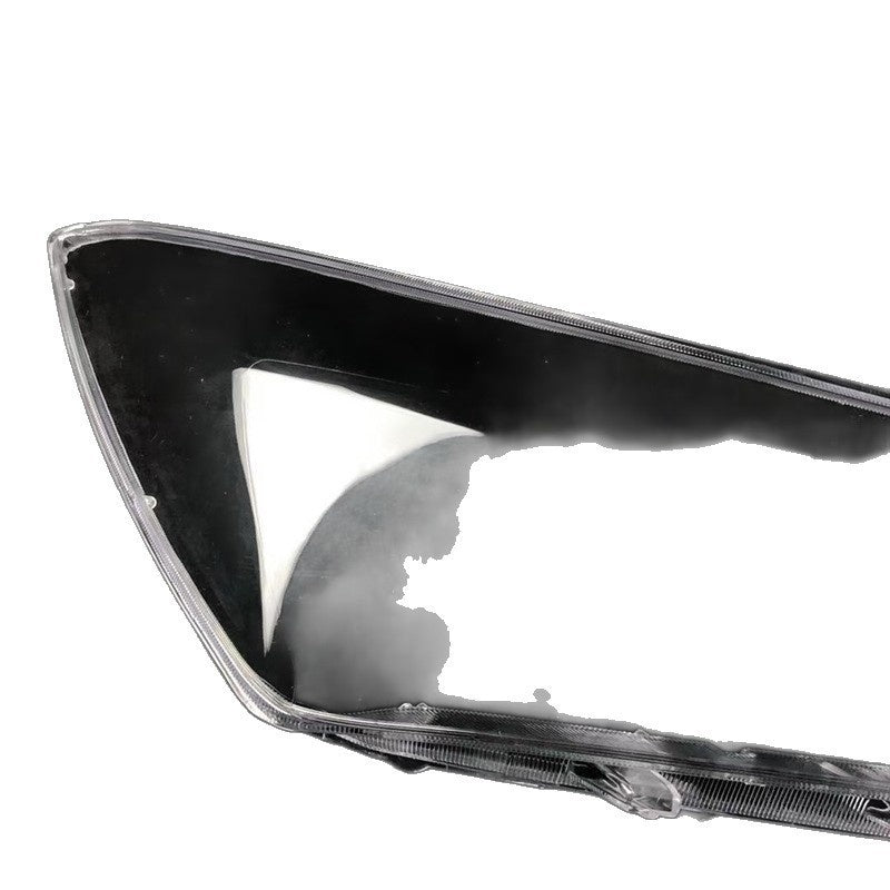 Clear lens headlamp housing with black surround, close-up