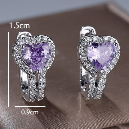 Heart-shaped ear clips with purple heart stones and silver pavé setting