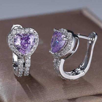 Heart-shaped clip earrings with purple center stones and pavé silver setting