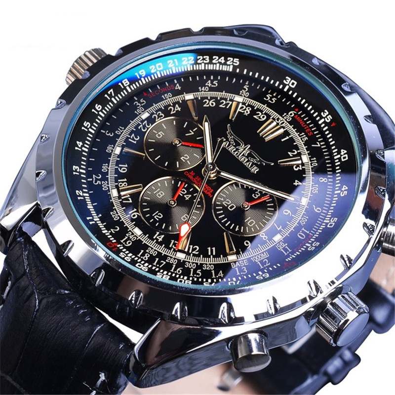 Close-up of a detailed wristwatch with multiple dials and a black strap.