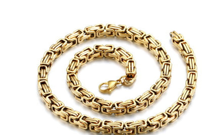 Gold chain necklace on a white background