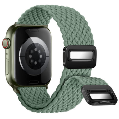 Smartwatch with a green braided band and black metal clasp on a white background