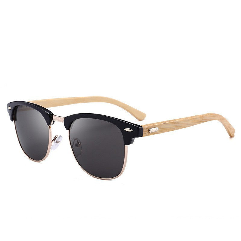 Sunglasses with black lenses and wooden frame on a white background