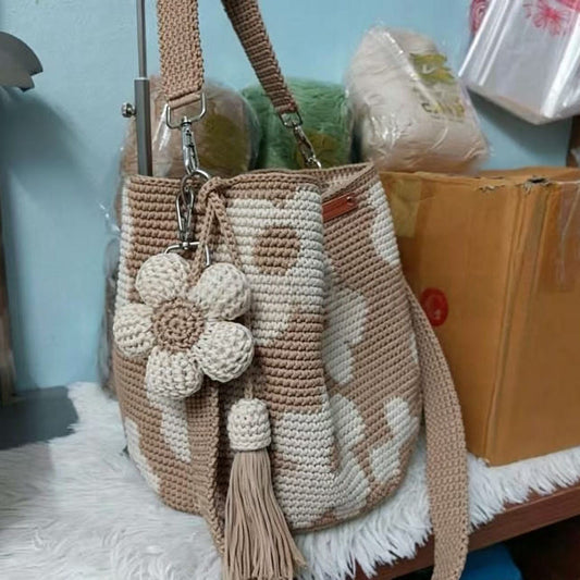 Hand-crocheted flower tote bag in beige with white crocheted flowers and tassel