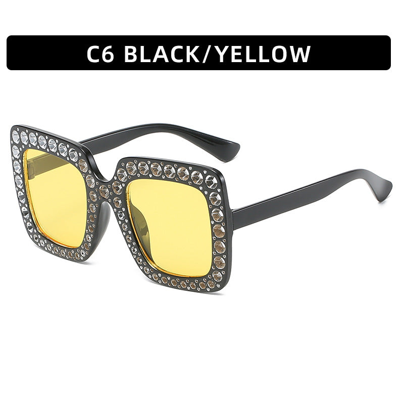 Square rhinestone sunglasses with black frame and yellow tinted lenses