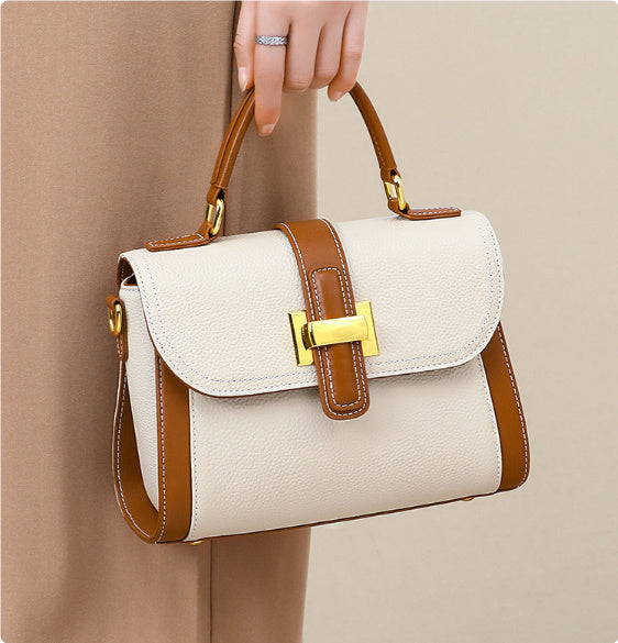 Women’s genuine leather handbag with flap, contrast tan handles, gold buckle