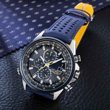Wristwatch with blue strap and black dial on a textured surface