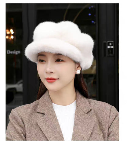 Woman wearing a white fur hat indoors with blurred background