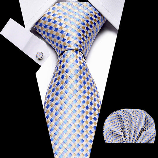 Blue and gold checkered tie with matching pocket square on a white background