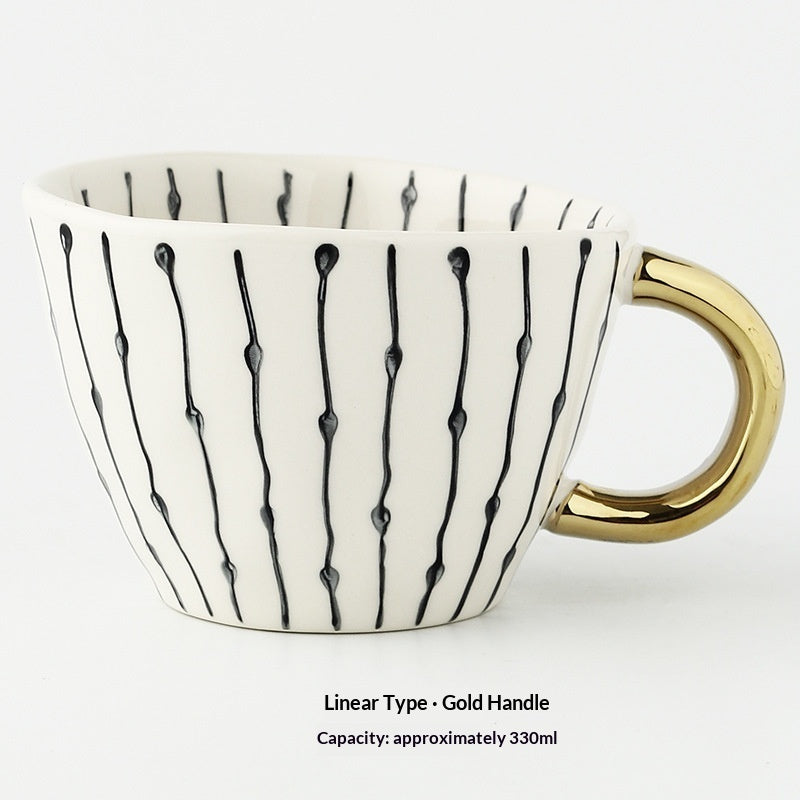 Ceramic mug with vertical linear motif and gold handle