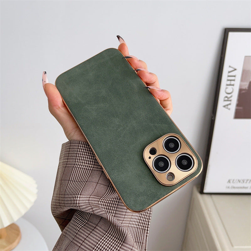 Hand holding a green phone case with a gold edge