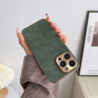 Hand holding a green phone case with a gold edge