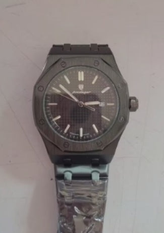 Dark gray mechanical watch with black textured dial and metal link strap