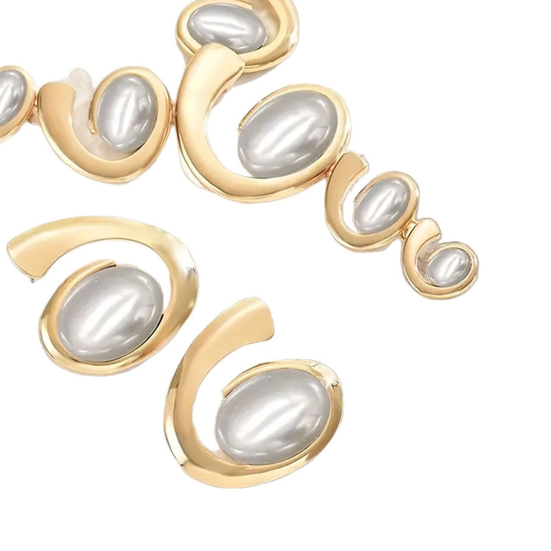 Gold and pearl bracelet on a white background