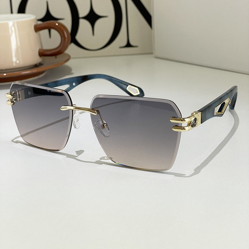 Square sunglasses with dark lenses, blue-gray frame, gold-tone geometric side plates