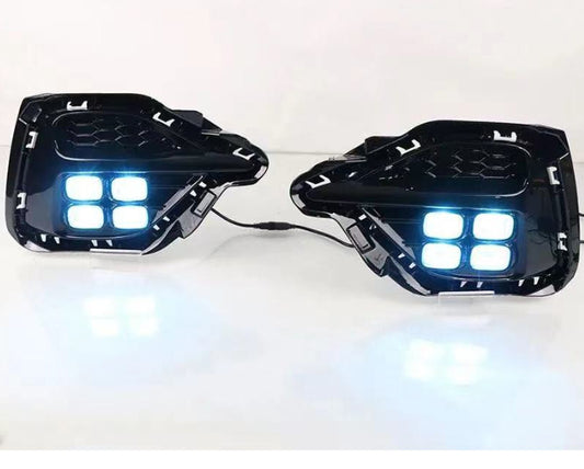 Two black LED lights with blue illumination on a white background