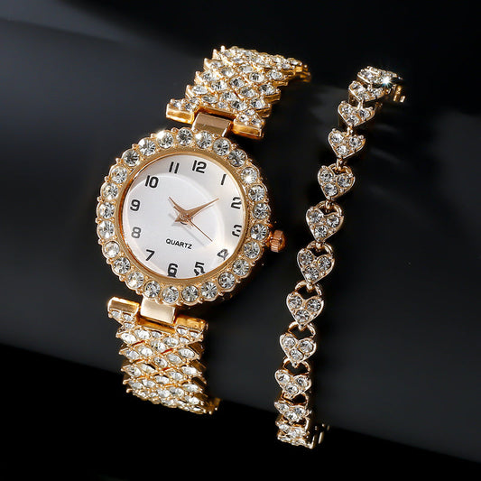 Rose-gold-tone stone-set watch and matching heart-link bracelet on a dark background