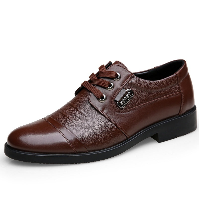 Brown leather dress shoe on a white background