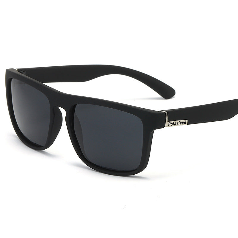 Polarized sports sunglasses with matte black frame and dark square lenses, side view