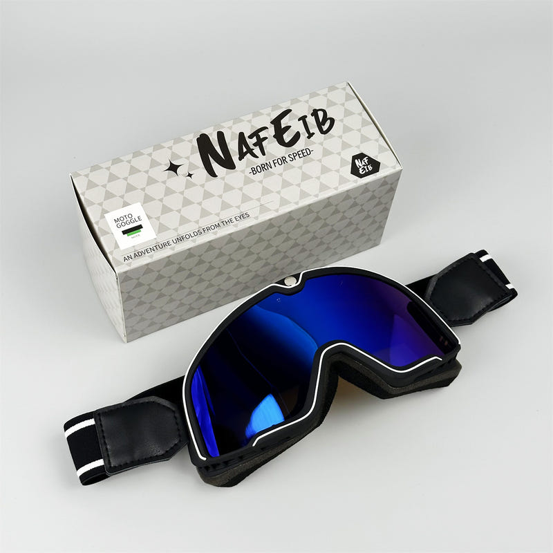 Black motorcycle goggles with cobalt blue reflective lens and adjustable strap