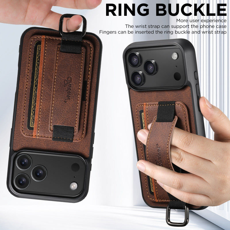 Brown phone case with ring buckle and wrist strap, held by a hand.