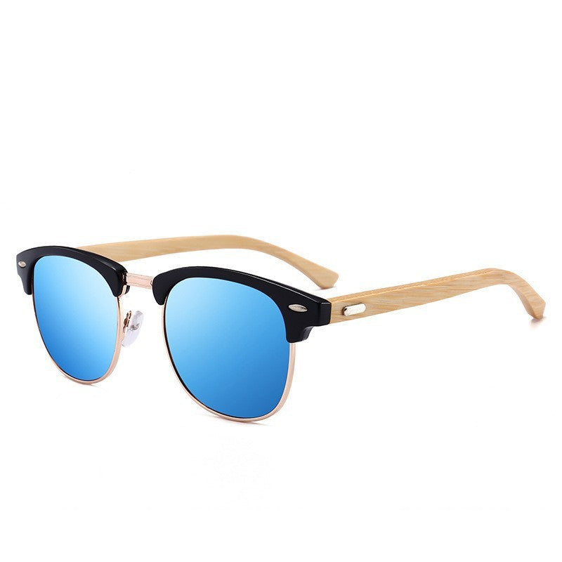 Sunglasses with black and gold frame and blue lenses on a white background