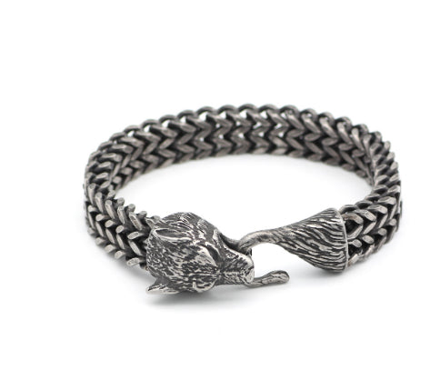 Braided stainless steel bracelet with black chain links and silver animal-head charm