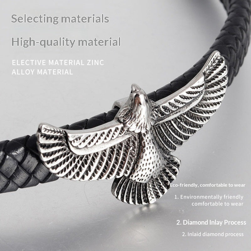 Black braided leather bracelet with prominent silver eagle head center piece