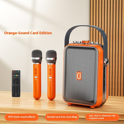 Orange karaoke Bluetooth speaker with two matching handheld microphones
