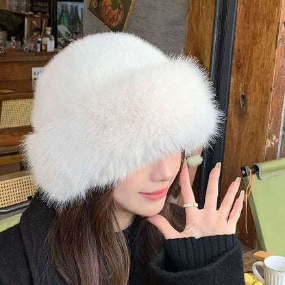 Person wearing a fluffy white hat indoors