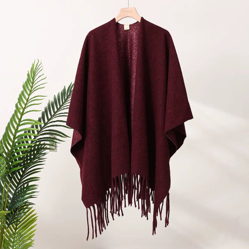 Burgundy tassel-fringe travel cape with draped fit and open neckline