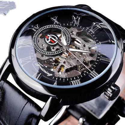 Close-up of a black wristwatch with transparent face and visible mechanical components.