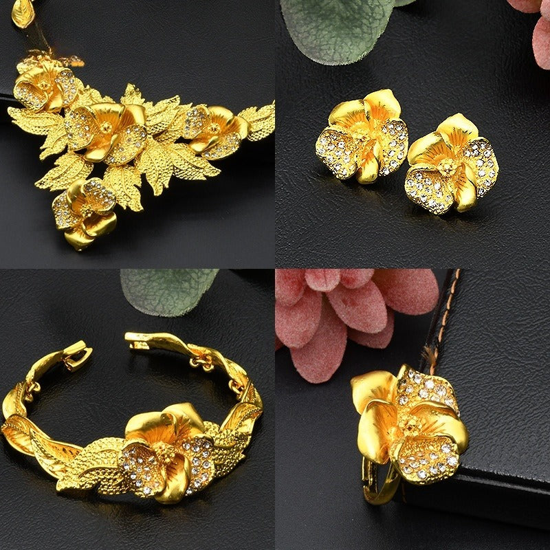 Gold-plated floral necklace with matching earrings and a hinged bracelet