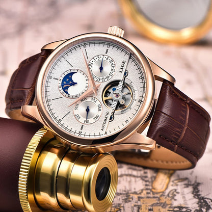 Luxury watch with brown leather strap and gold accents on a blurred map background