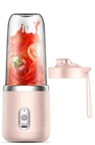 Portable blender with pink base and clear blending cup