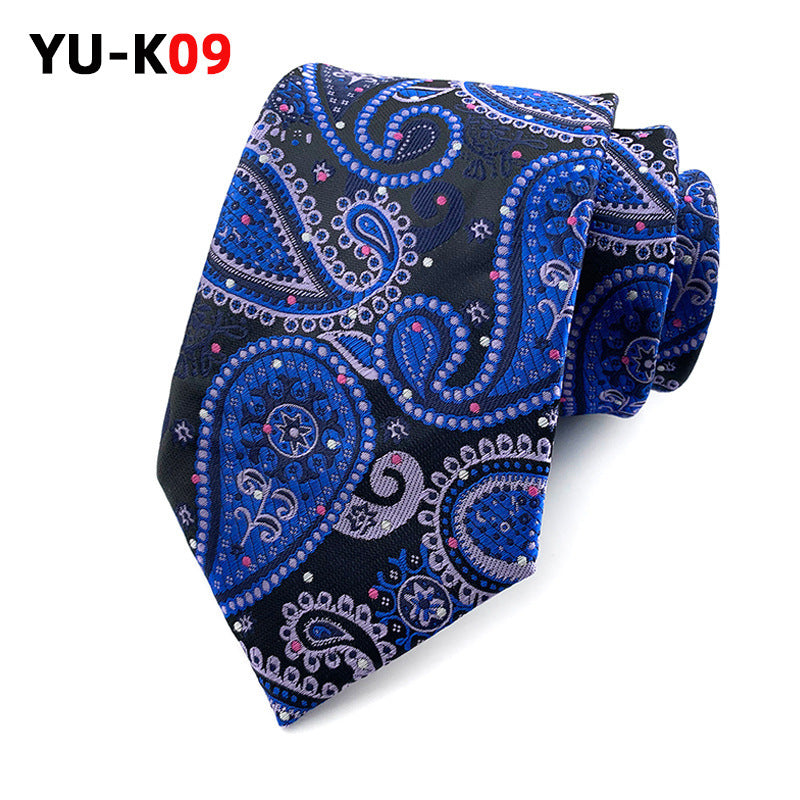 Blue paisley patterned tie on a white background