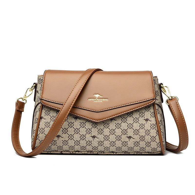 Beige logo-print crossbody shoulder bag with tan flap, gold-tone hardware, adjustable strap
