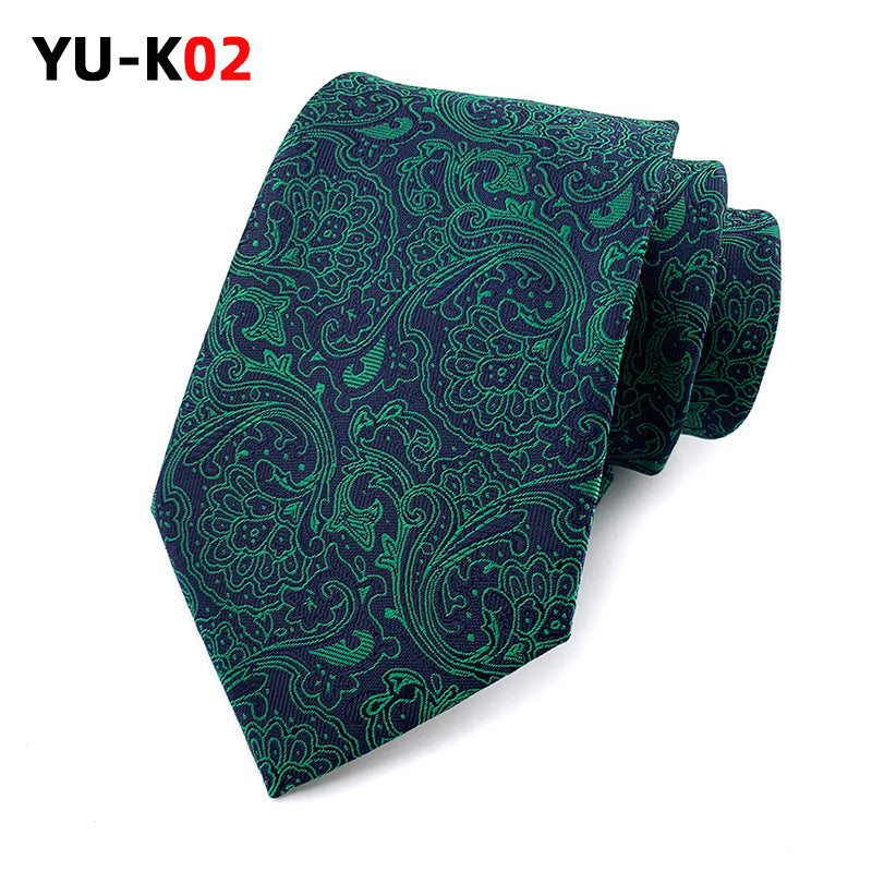 Green paisley patterned tie on a white background